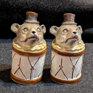 Porcelain salt and pepper shakers featuring mice with top hats on drum bases
